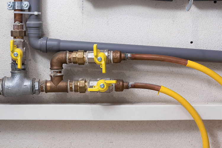 Closeup of gas lines in home.