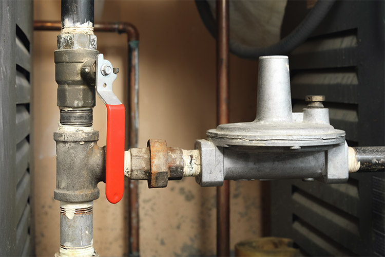 Close up of gas shut off valve.